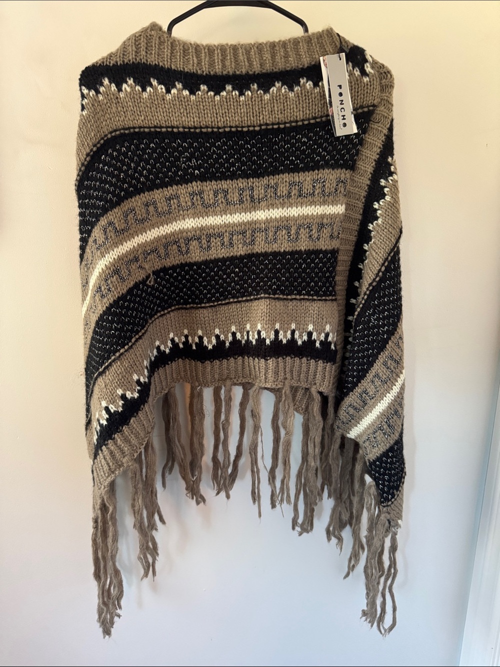 Poncho Knit Fringe Throw in Taupe, silver, cream, and Black by (Unknown)